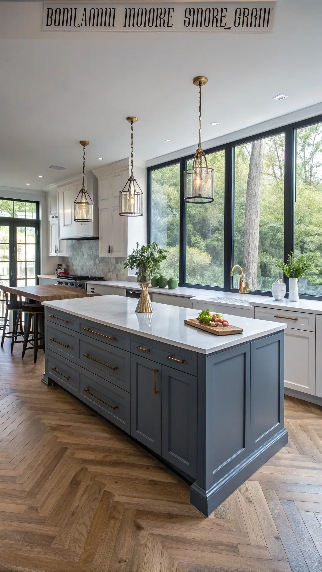 Modern kitchen featuring blue-gray shaker cabinets, white quartz countertops, oak herringbone flooring, and soft morning sunlight through tall windows.