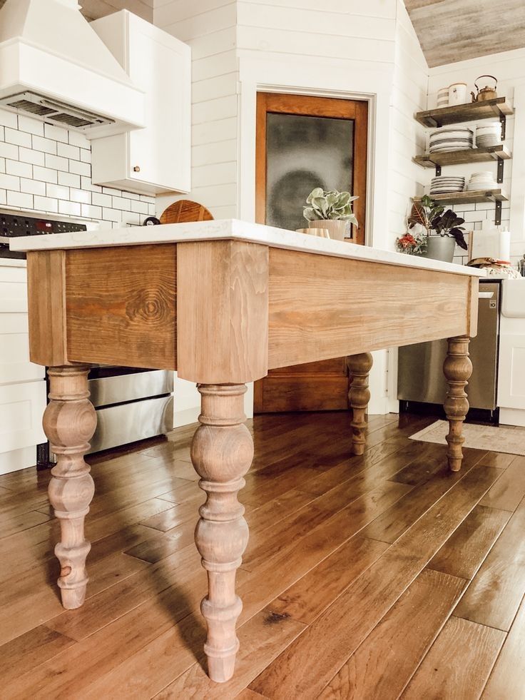 Charming Farmhouse Kitchen Island Featuring Stylish Legs Charming Farmhouse Kitchen Island Featuring Stylish Legs